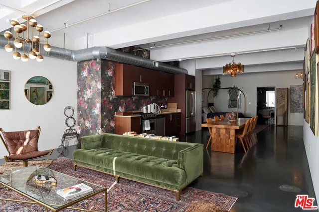 a living room with fireplace furniture and decor