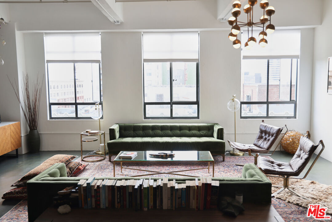 849 South Broadway, Unit 906 Los Angeles, CA 90014 - Photo 4 of 65 a living room with furniture and a window