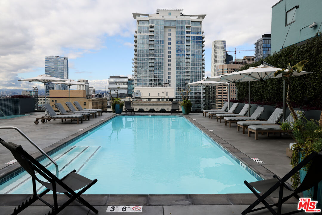 849 South Broadway, Unit 906 Los Angeles, CA 90014 - Photo 44 of 65 a view of a swimming pool with outdoor seating and a terrace