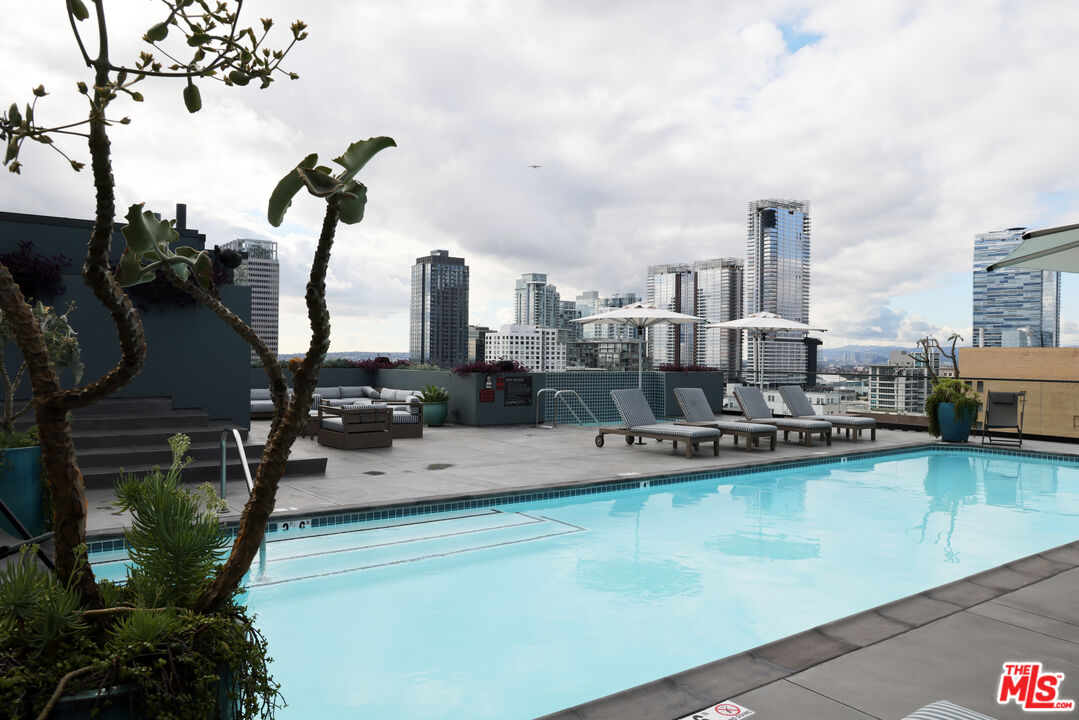 849 South Broadway, Unit 906 Los Angeles, CA 90014 - Photo 45 of 65 a view of a swimming pool with outdoor seating