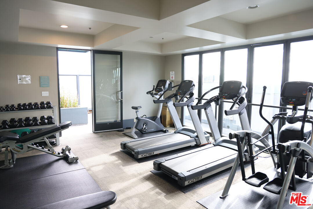 849 South Broadway, Unit 906 Los Angeles, CA 90014 - Photo 56 of 65 a view of a room with gym equipment