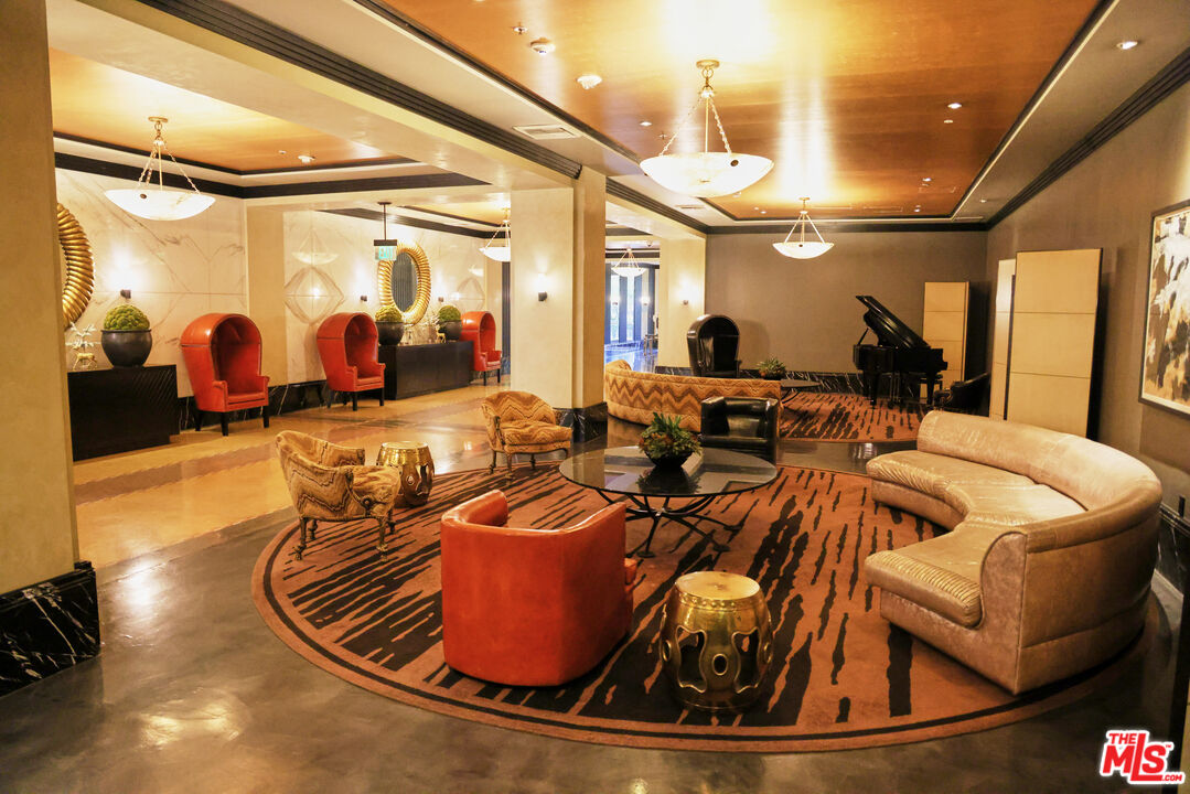 849 South Broadway, Unit 906 Los Angeles, CA 90014 - Photo 57 of 65 a room with lots of gym equipment