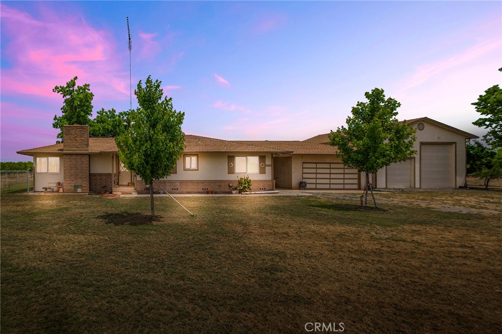 4580 Dayton West Road Chico, CA 95928 - Photo 1 of 75 a front view of a house with a garden