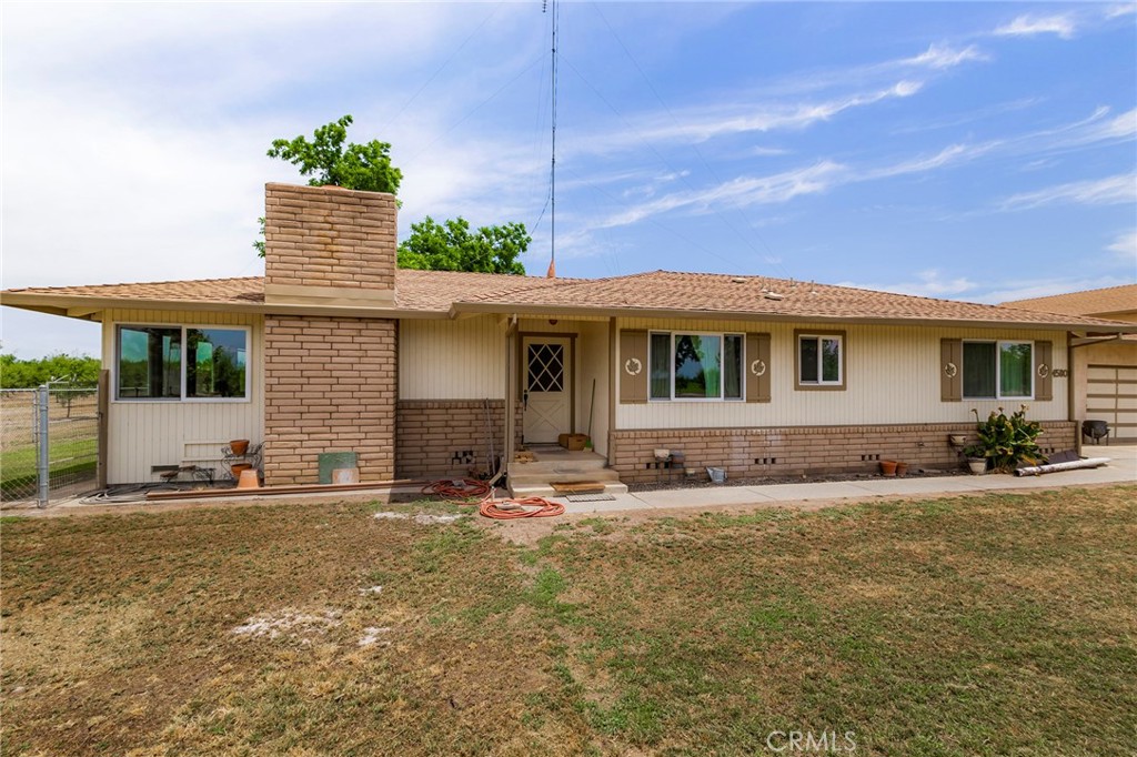 4580 Dayton West Road Chico, CA 95928 - Photo 12 of 75 a front view of a house with a garden