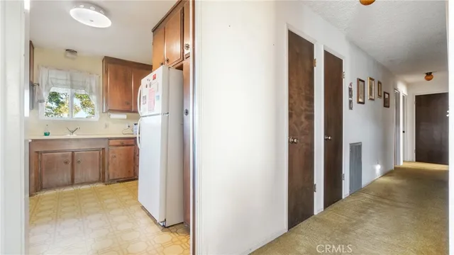 a kitchen with a stove and a refrigerator