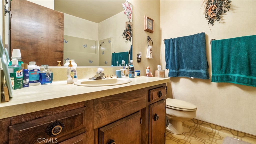 4580 Dayton West Road Chico, CA 95928 - Photo 26 of 75 a bathroom with a sink a toilet and shower