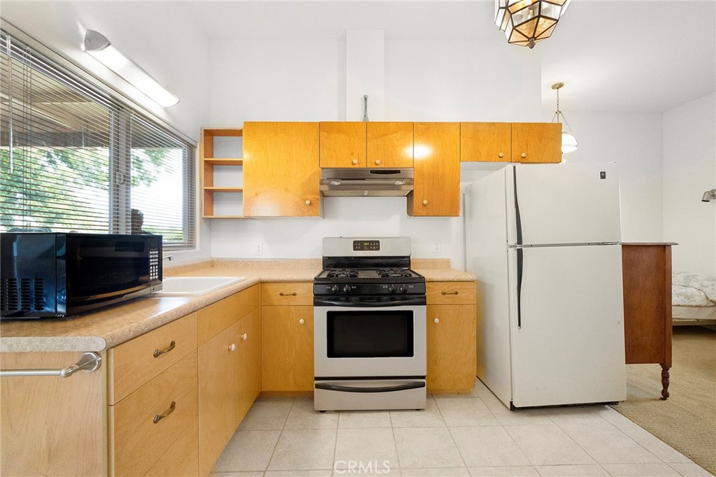 4580 Dayton West Road Chico, CA 95928 - Photo 31 of 75 a kitchen with a stove and a refrigerator