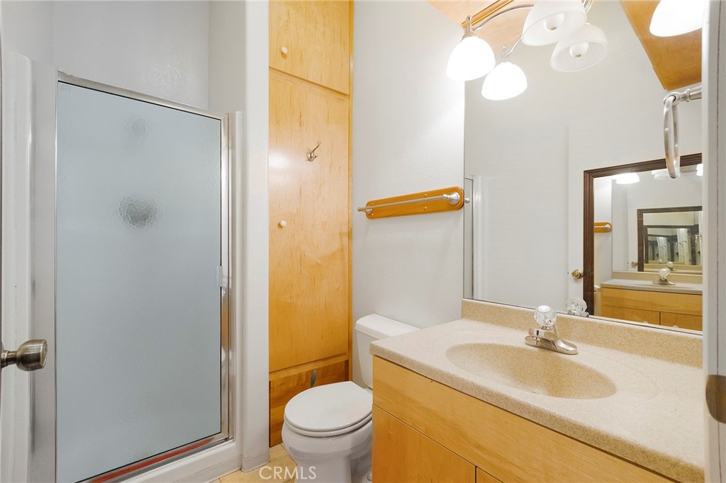 4580 Dayton West Road Chico, CA 95928 - Photo 35 of 75 a bathroom with a granite countertop sink toilet and shower