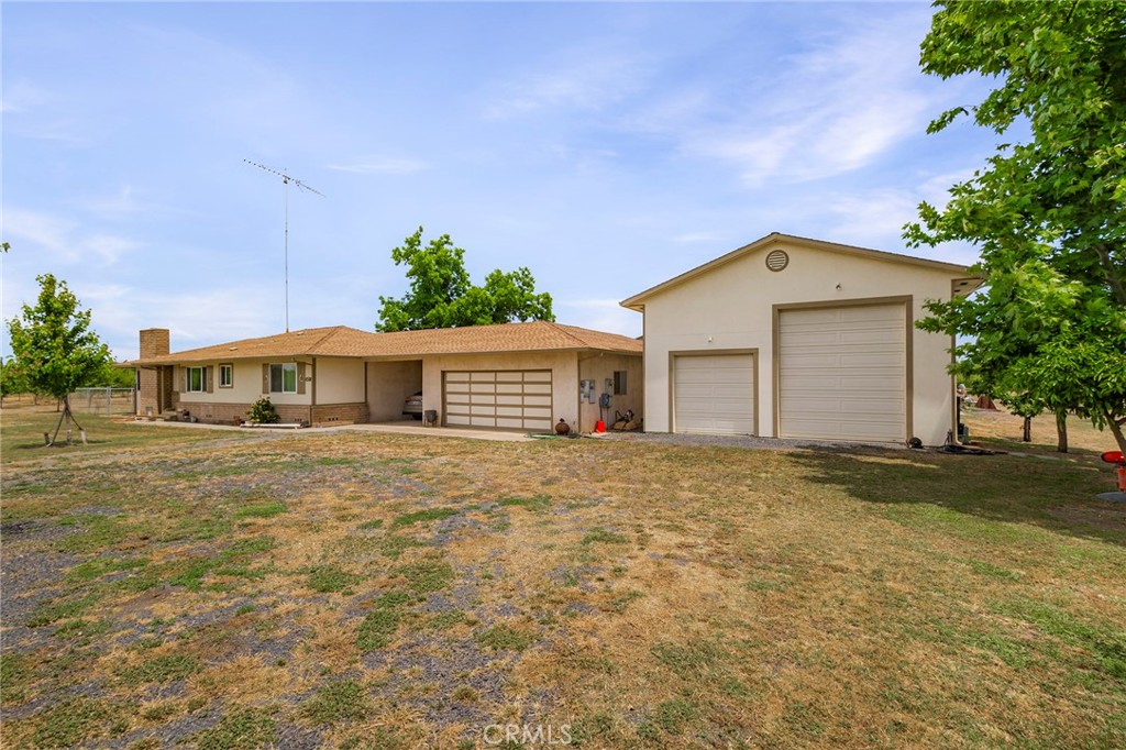 4580 Dayton West Road Chico, CA 95928 - Photo 9 of 75 a front view of a house with a yard and garage