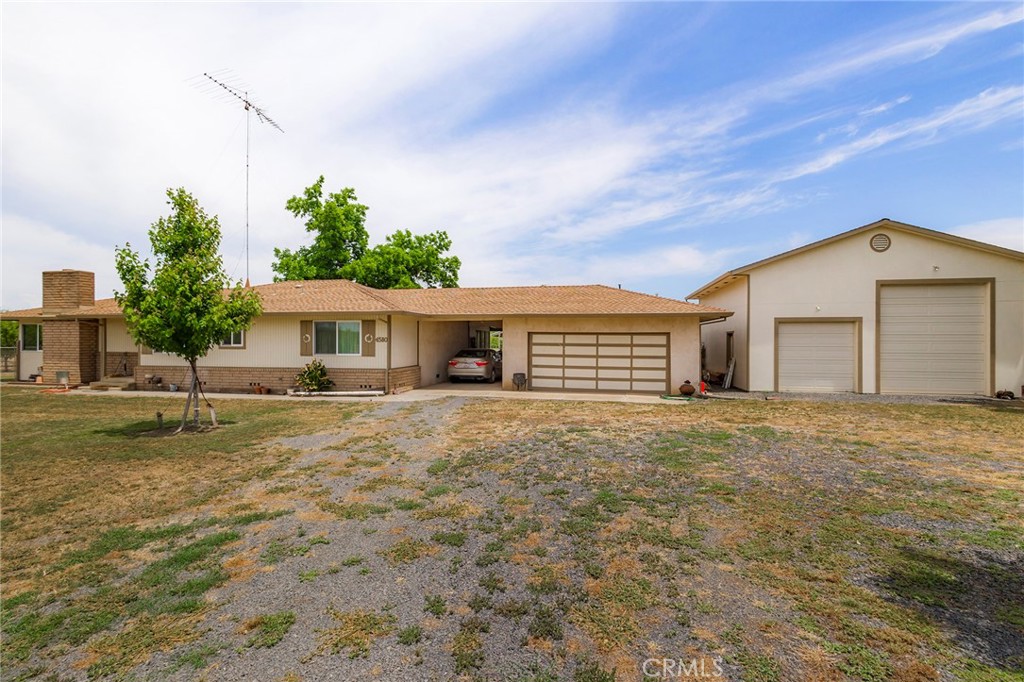 4580 Dayton West Road Chico, CA 95928 - Photo 10 of 75 a front view of a house with a garden and yard
