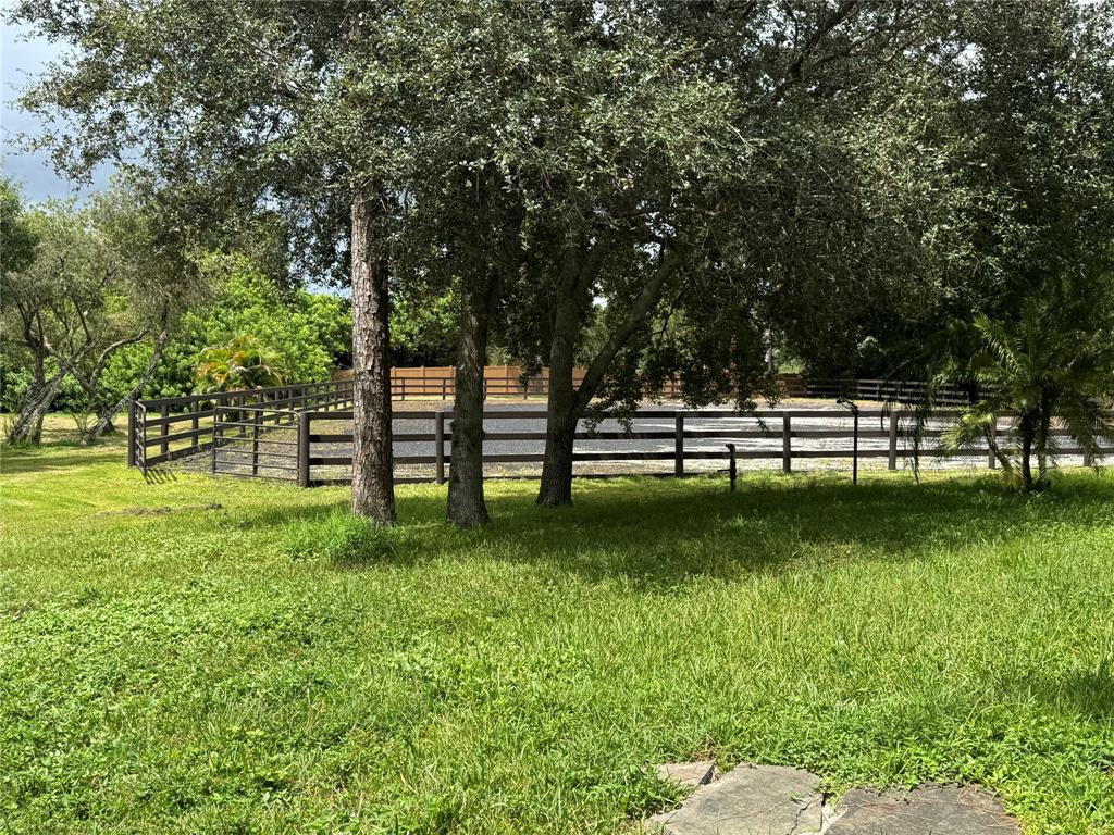 3015 Southeast Ranch Acres Circle Jupiter, FL 33478 - Photo 3 of 4 a view of a park with large trees
