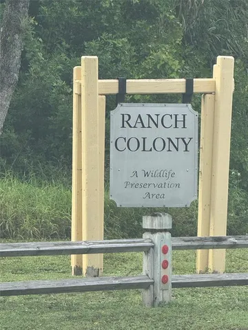 a view of outdoor space with sign board and yard