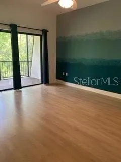 a view of an empty room with a window