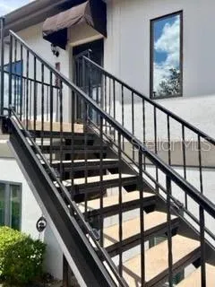 a view of staircase with a lots of trees