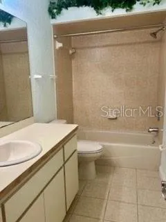 a bathroom with a sink a toilet and bathtub