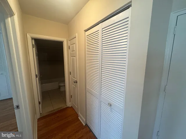 a view of a hallway with a white door
