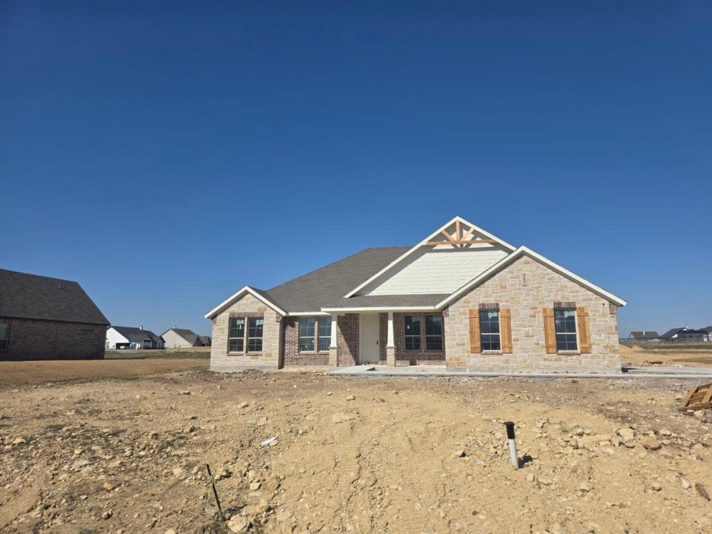 a view of house with wooden fence