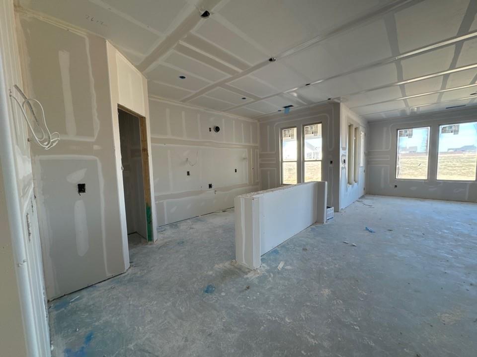 116 Snowy Owl Trail Rhome, TX 76078 - Photo 4 of 14 en empty room with windows and entrance