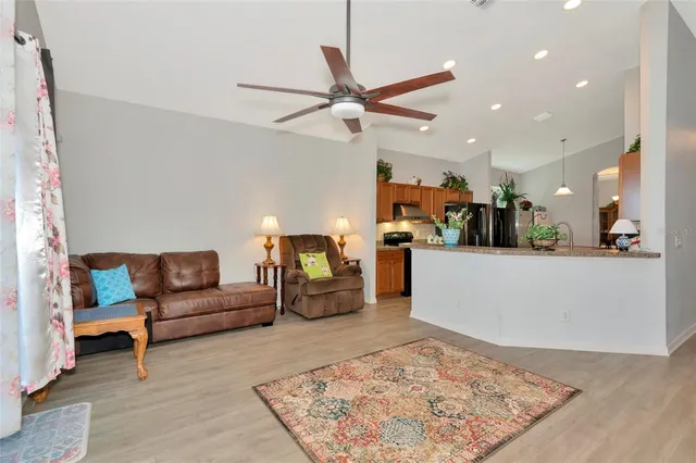a living room with furniture and a rug