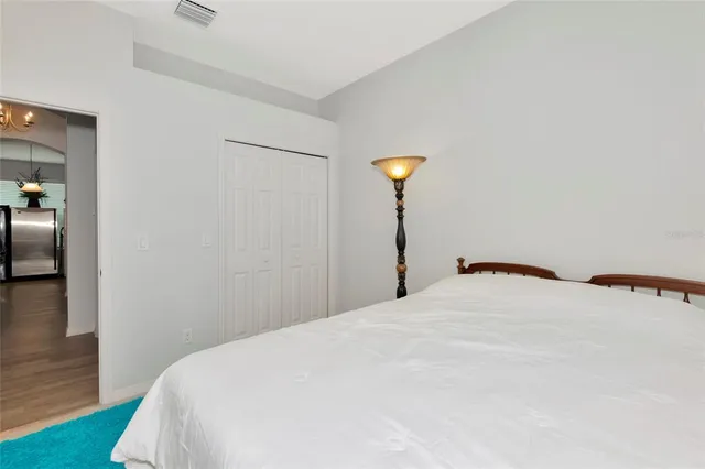 a bedroom with a bed and a table