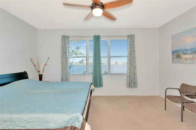 a bedroom with a bed and with furniture