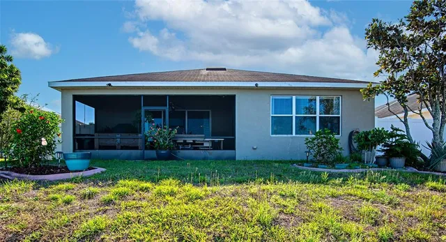 a aerial view of a house with a yard