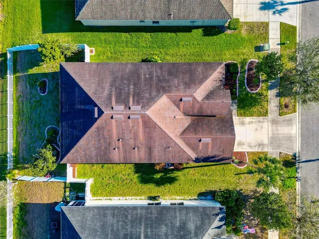 an aerial view of residential houses with outdoor space