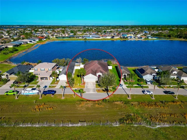 an aerial view of residential building and ocean