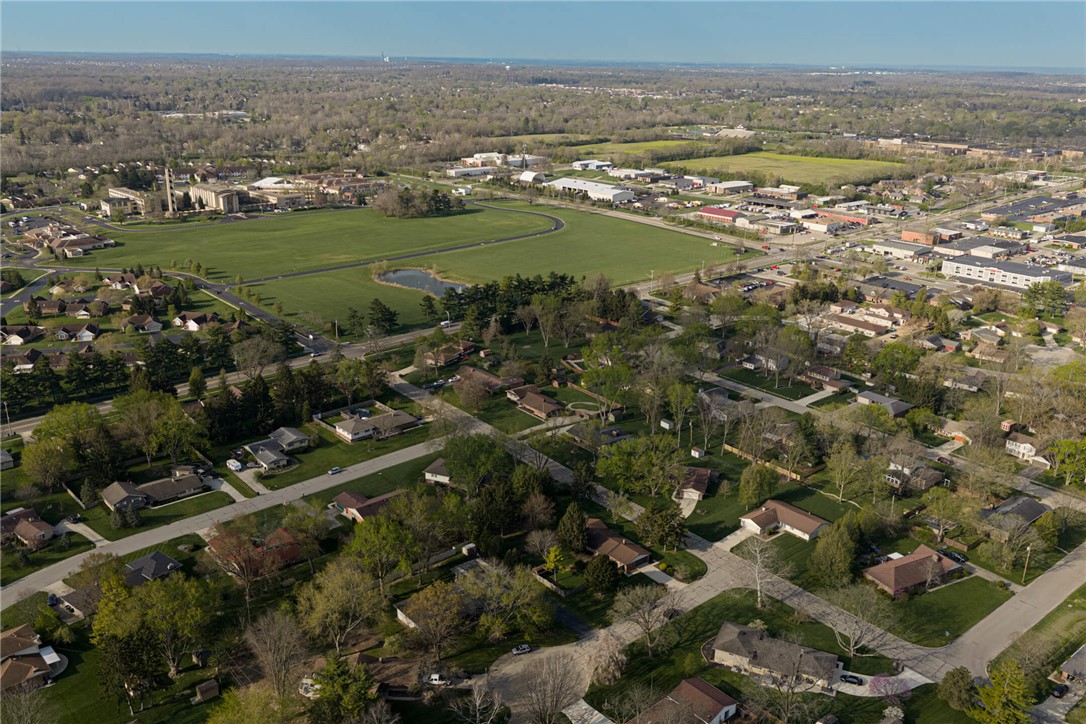 7850 Rain Tree Road Dayton, OH 45459 - Photo 41 of 41 This elevated perspective captures the expansive community with diverse properties and abundant green spaces.