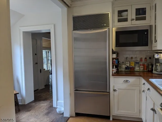 a kitchen with cabinets and stainless steel appliances