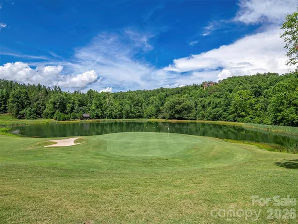 a view of a golf course with a lake