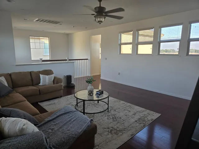 a kitchen with a stove and a wooden cabinets