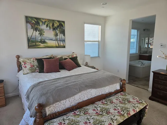 a kitchen with sink a microwave and cabinets