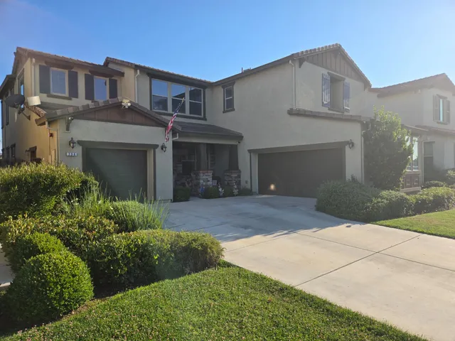 a view of a chairs and table in the patio