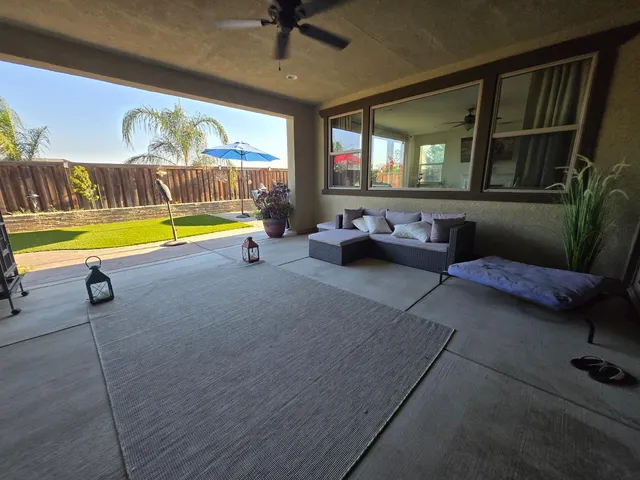 a living room with furniture and a table