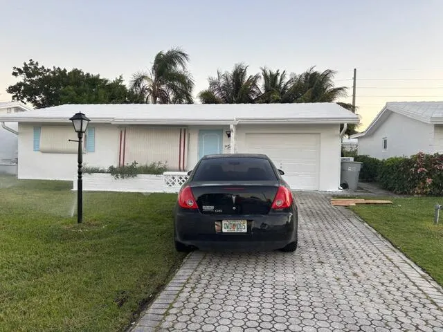a car parked in front of a house