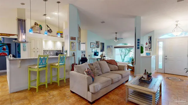 a view of a livingroom with furniture and a flat screen tv