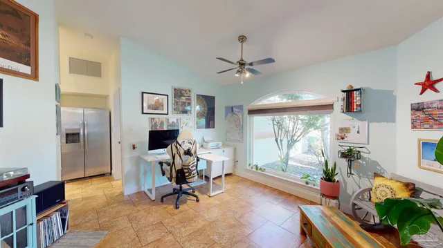 a kitchen with granite countertop cabinets and window