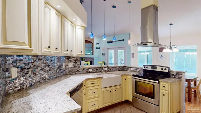 a kitchen with a sink cabinets and window
