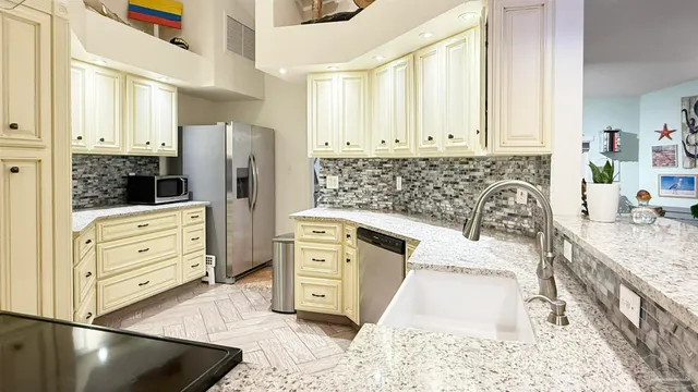 a view of living room with furniture and floor to ceiling windows