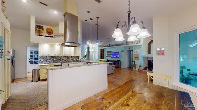 a spacious bedroom with a bed and a flat screen tv