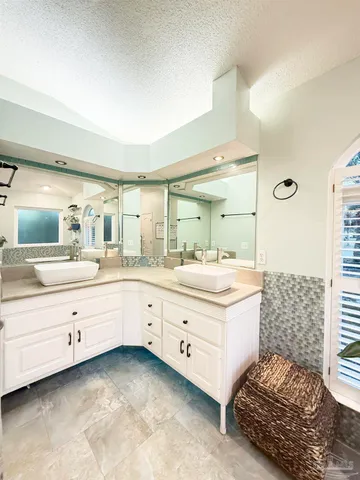 a bed room with furniture and a flat screen tv