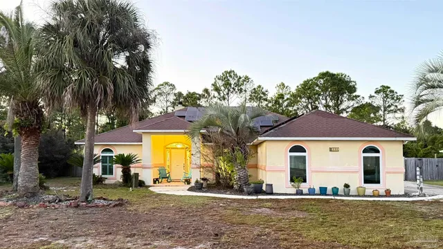 a front view of house with yard having outdoor seating