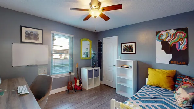 a room with gym equipment and a potted plant