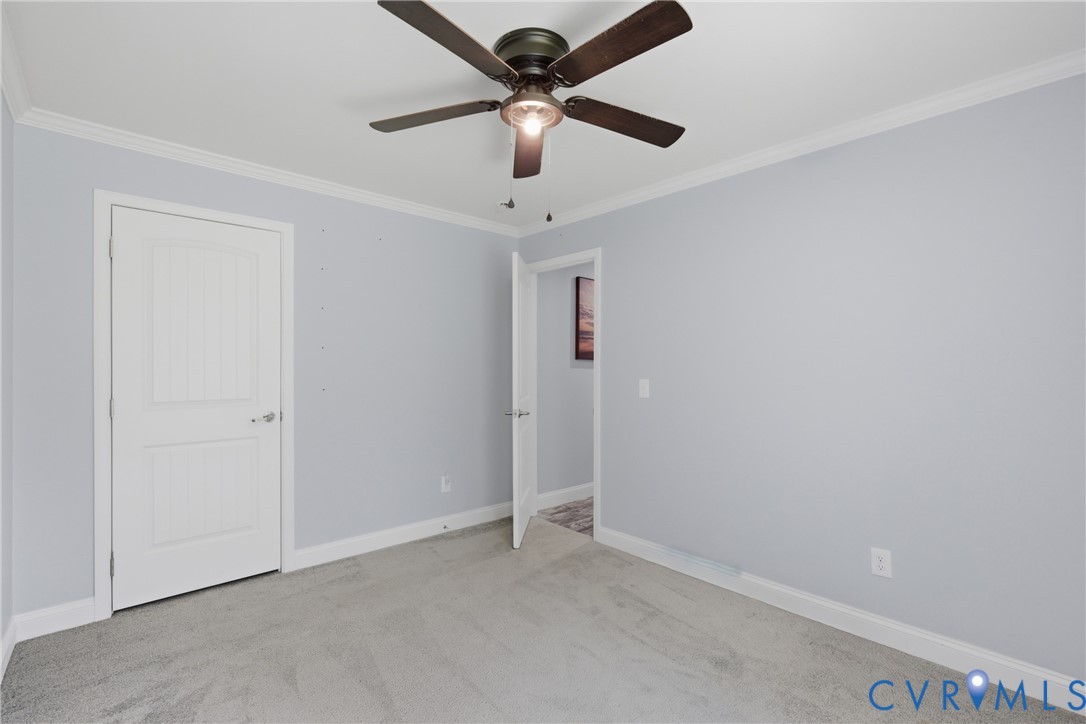 93 Faraway Road Saluda, VA 23149 - Photo 27 of 58 an empty room with a ceiling fan and a ceiling fan