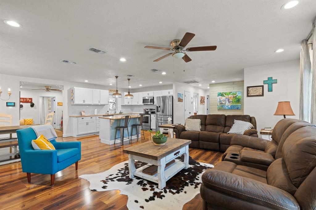 605 South 3rd Street Grandview, TX 76050 - Photo 9 of 23 Living room featuring a ceiling fan, recessed lighting, and wood finished floors