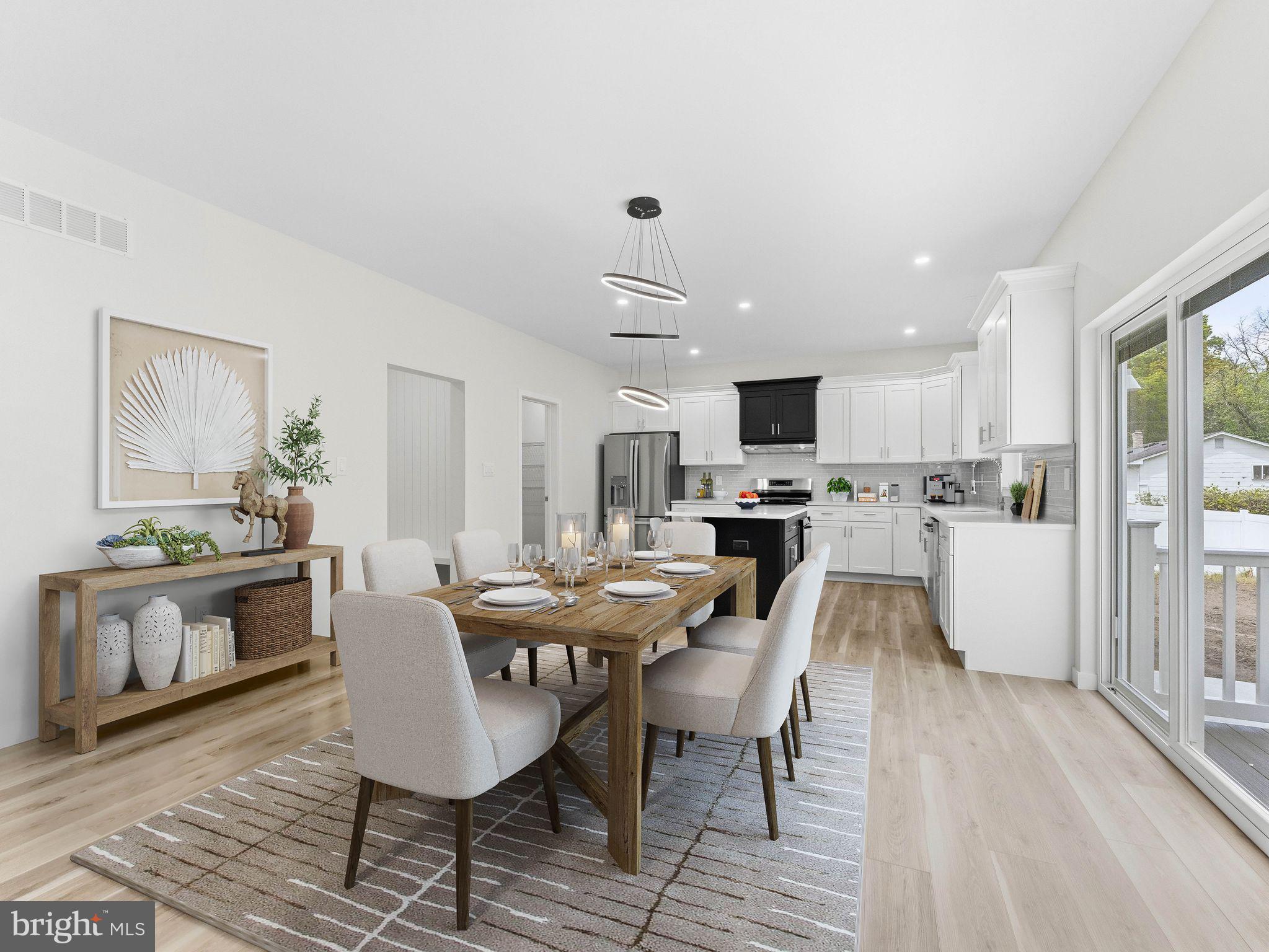 1327 Filbert Street Glassboro, NJ 08028 - Photo 18 of 47 Modern kitchen with dining elegance.