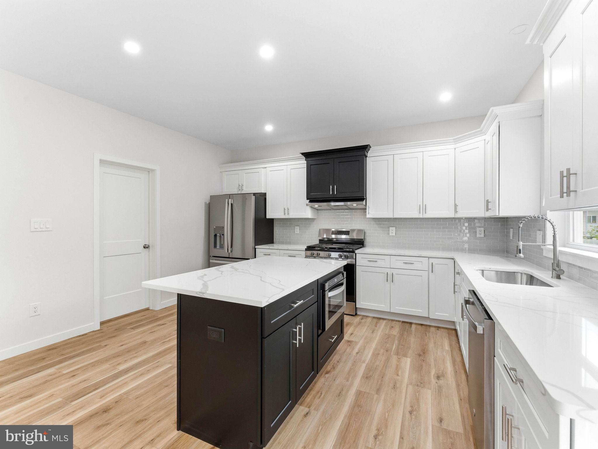 1327 Filbert Street Glassboro, NJ 08028 - Photo 20 of 47 Sleek modern kitchen with elegant finishes.