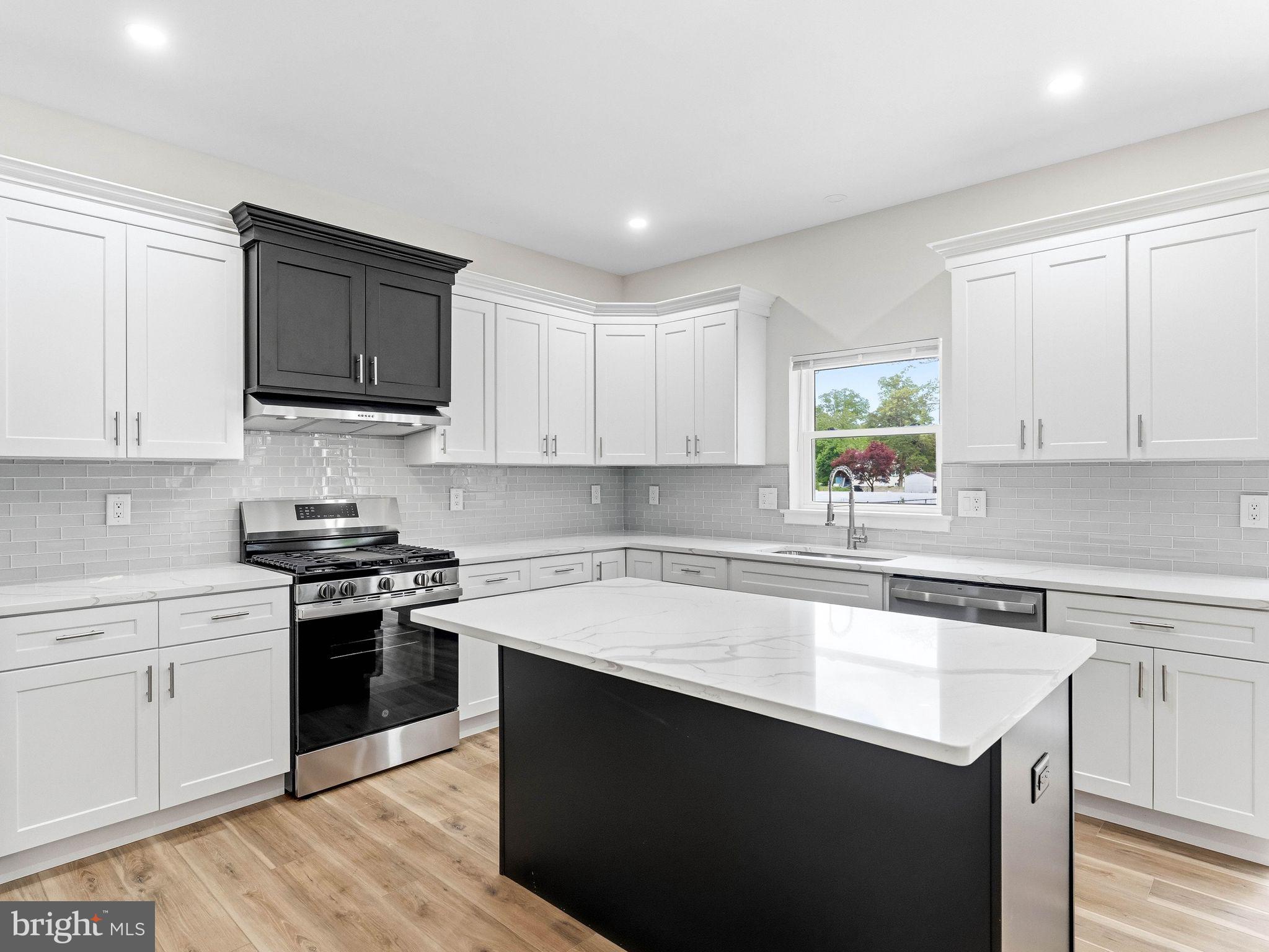 1327 Filbert Street Glassboro, NJ 08028 - Photo 22 of 47 Modern kitchen with sleek design.