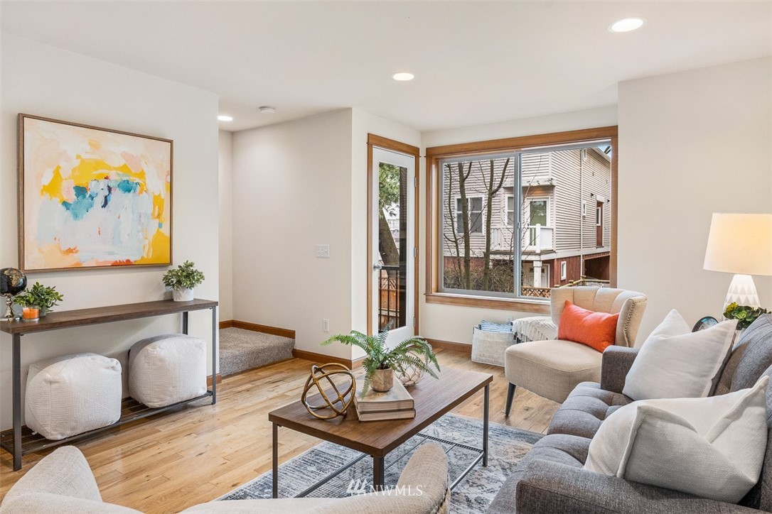 1122 North 92nd Street, Unit B Seattle, WA 98103 - Photo 18 of 32 a living room with furniture and a large window